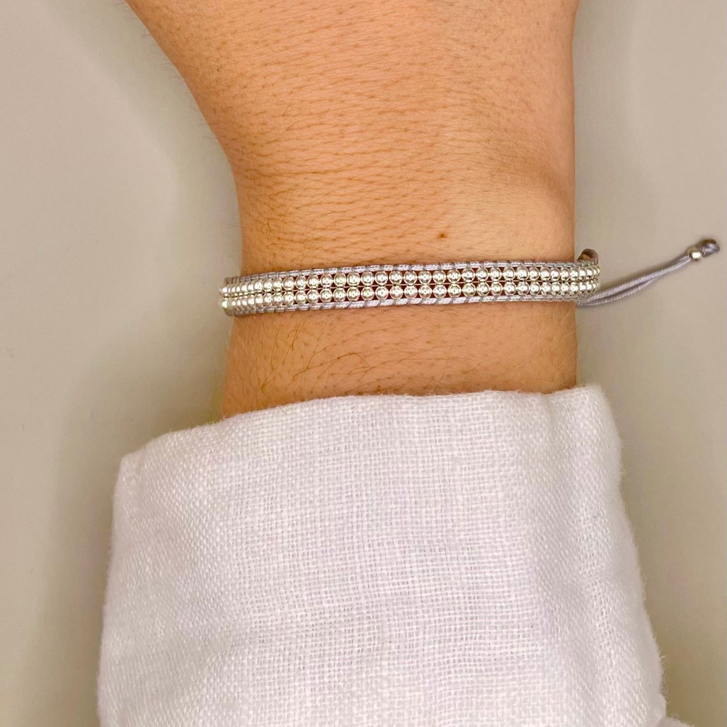 Brazalete tejido y ajustable Plata